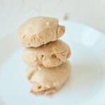 A stack of three butter pecan cookies.