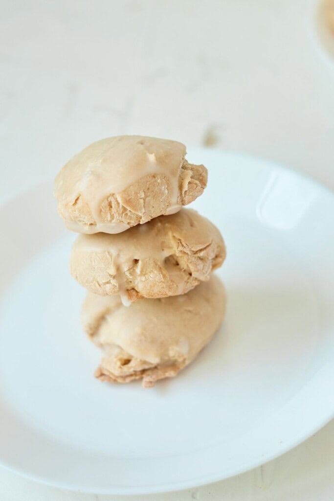 A stack of three butter pecan cookies.