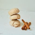Cinnamon sticks next to a stack of the butter pecan cake mix cookies.