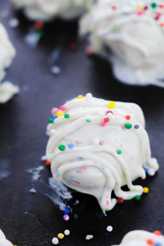 A close up on the sugar cookie truffle with rainbow sprinkles.