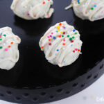 Featured image showing the finished funfetti cake mix cookies truffles ready to be eaten.