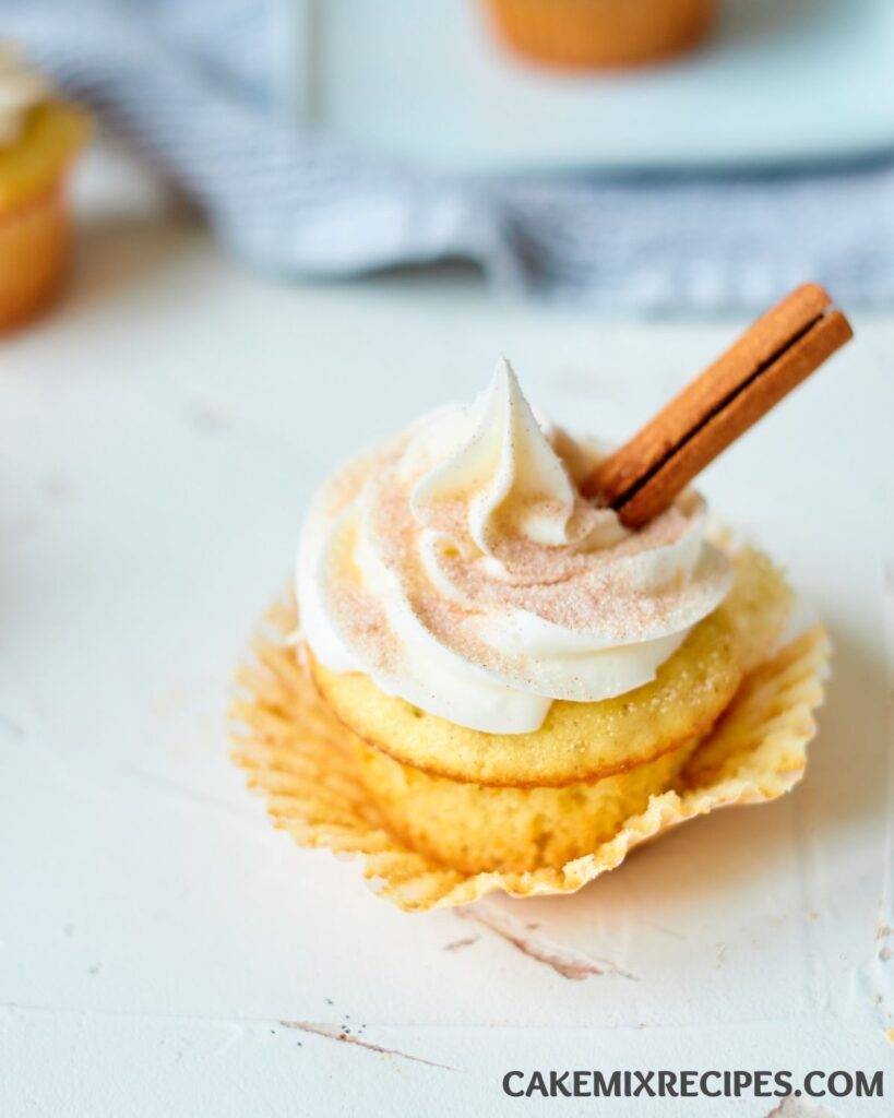 a snickerdoodle cupcake on a white counter.