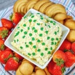 A top shot of the shamrock dunkaroo dip with all the fruit and cookies around it.
