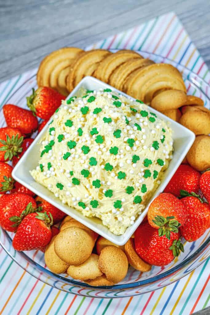 A top shot of the shamrock dunkaroo dip with all the fruit and cookies around it.