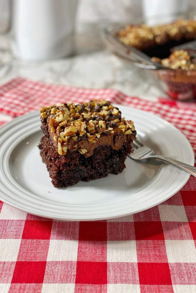 A square of the chocolate caramel poke cake.
