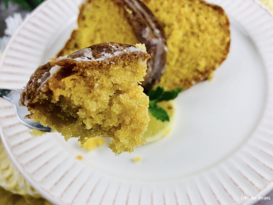 A close up view of the finished lemon bundt cake with cake mix.