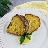 A plate with two slices of the finished lemon bundt cake with cake mix ready to eat.