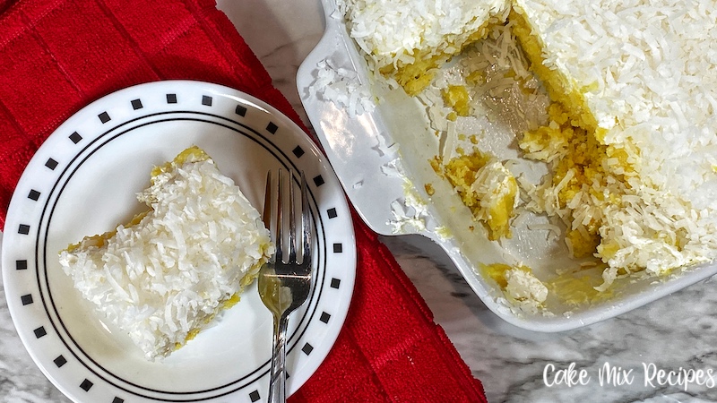 Featured image showing the finished pineapple coconut poke cake ready to eat.