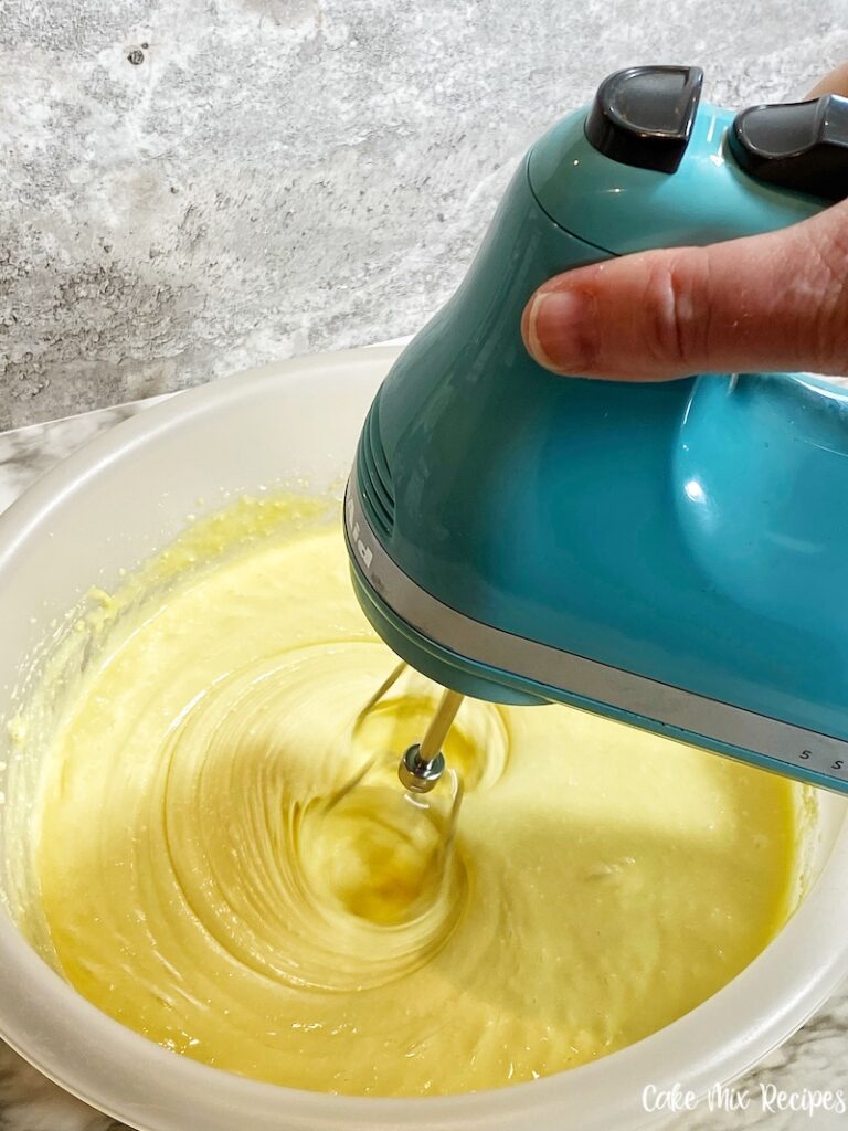 Cake mix being mixed up. 