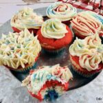 Featured image showing the finished layered red white and blue cupcakes ready to eat.