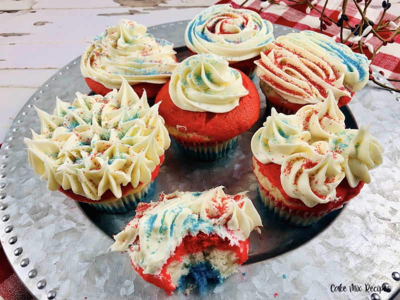 Featured image showing the finished layered red white and blue cupcakes ready to eat.