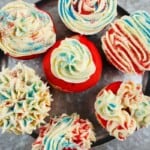 A platter of festive red white and blue cupcakes.