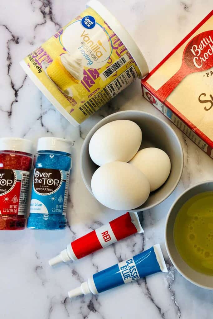 A box of the mix, eggs and food coloring.
