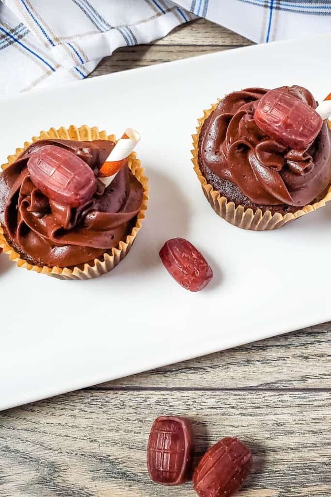 A dessert on a white tray with candy around.