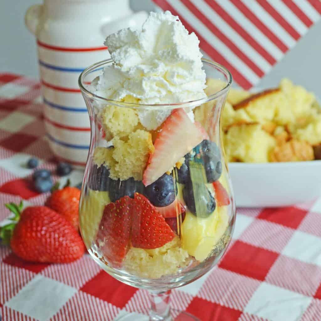 Strawberries, blueberries and cake in a cup.