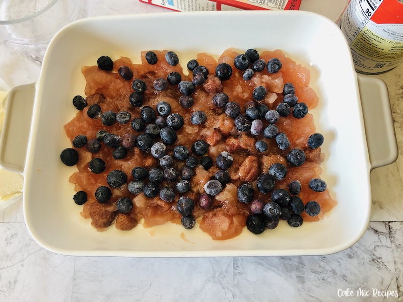 Frozen blueberries added to the bottom of the baking pan. 