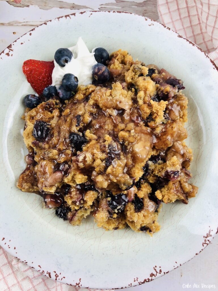 a look at the berry dump cake cobbler on a plate ready to eat. 