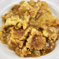 Featured image showing a serving of the finished caramel apple dump cake recipe ready to eat.