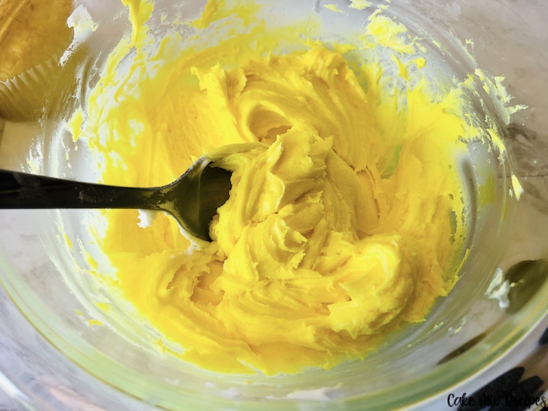 frosting mixed up with yellow food coloring to create bright yellow vanilla icing. 
