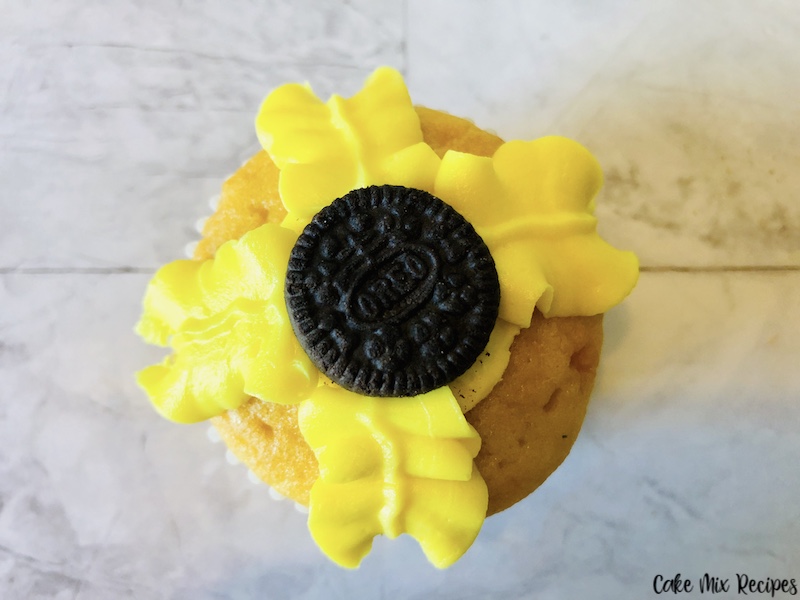 first layer of petals make in a cross shape around the Oreo. 