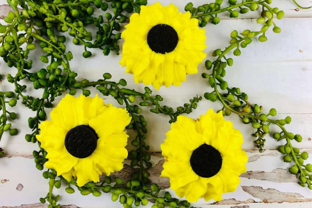 Three oreo sunflower cupcakes.