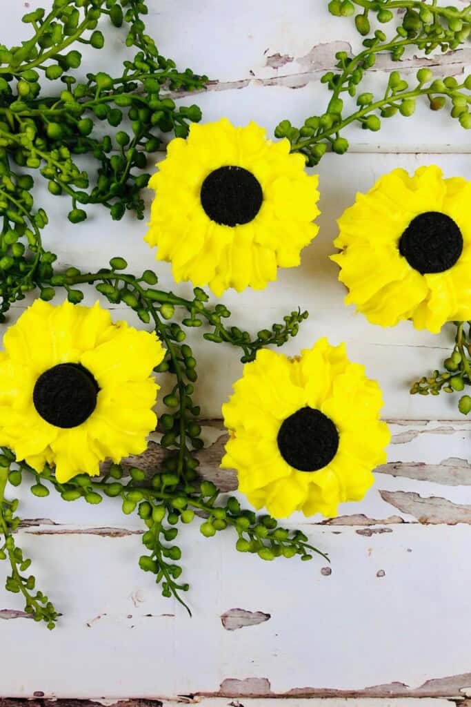 Four oreo sunflower cupcakes.