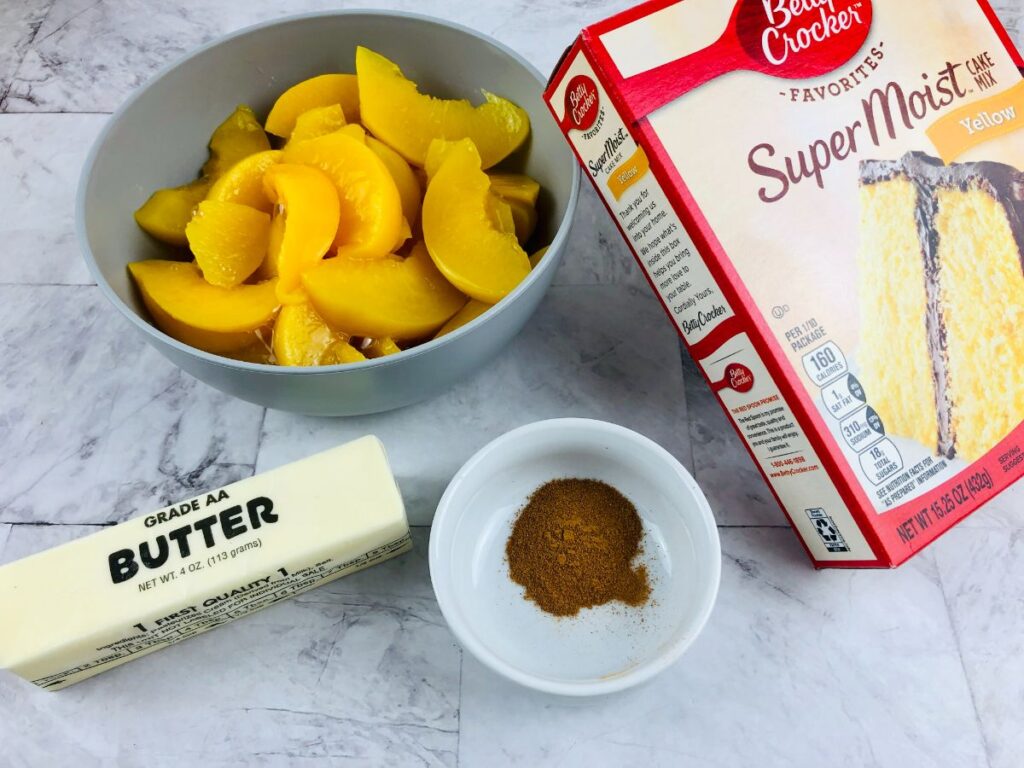ingredients to make easy peach cobbler with cake mix