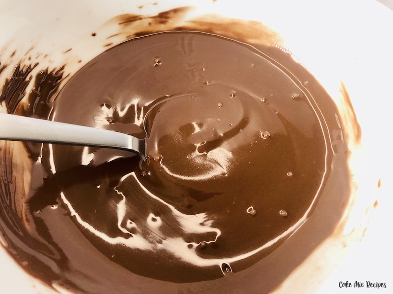 melted chocolate ready to coat the cookies and cones. 