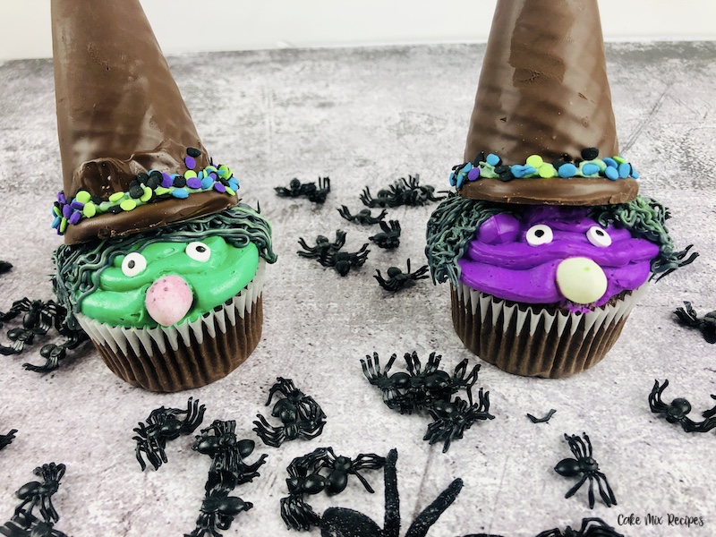 a pair of the finished halloween spooky witch cupcakes ready to eat. 