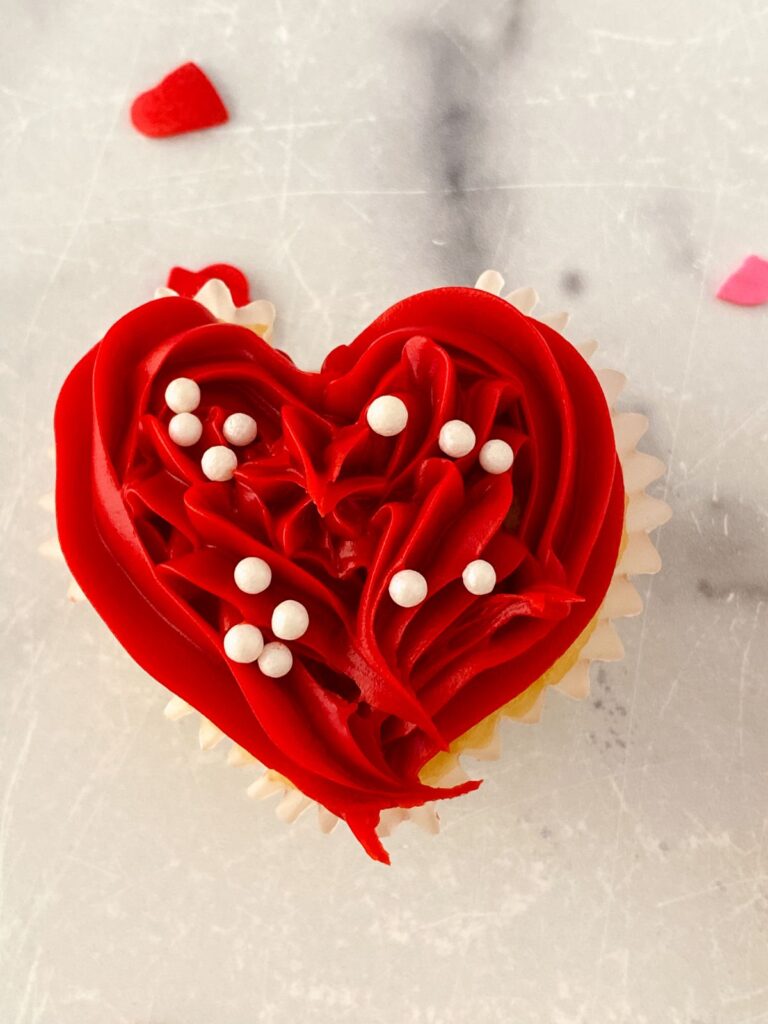 a closeup of a heart cupcake