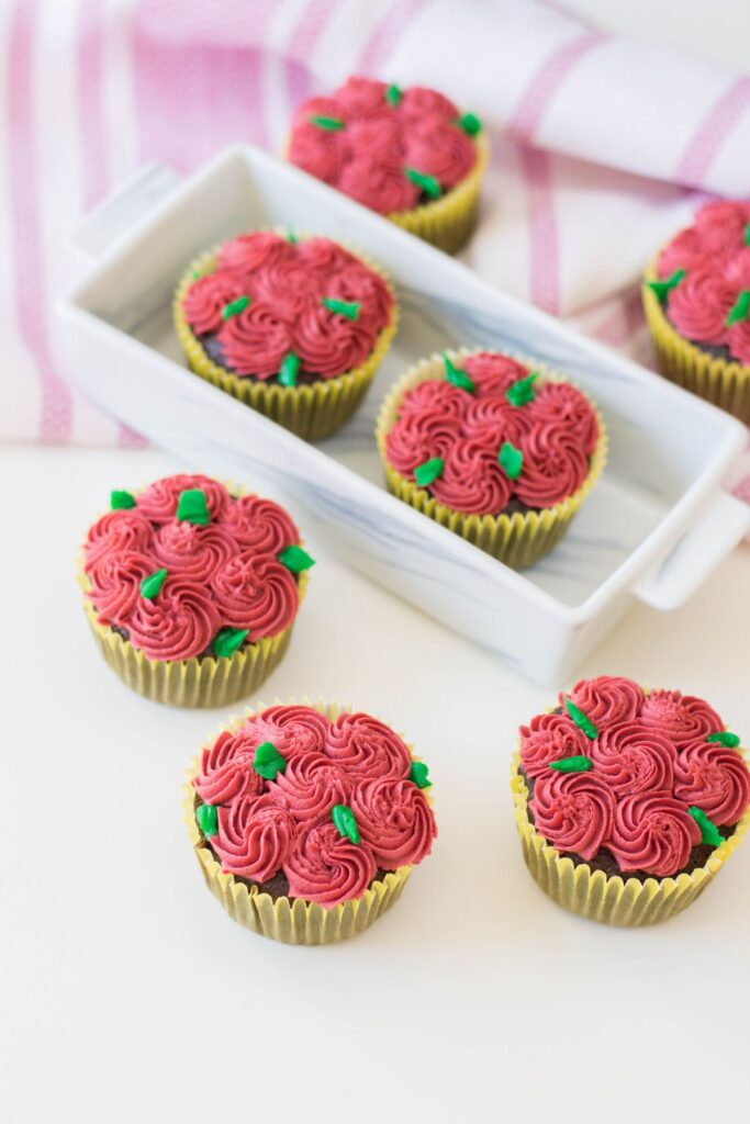 rosette cupcakes on a table and in a serving tray