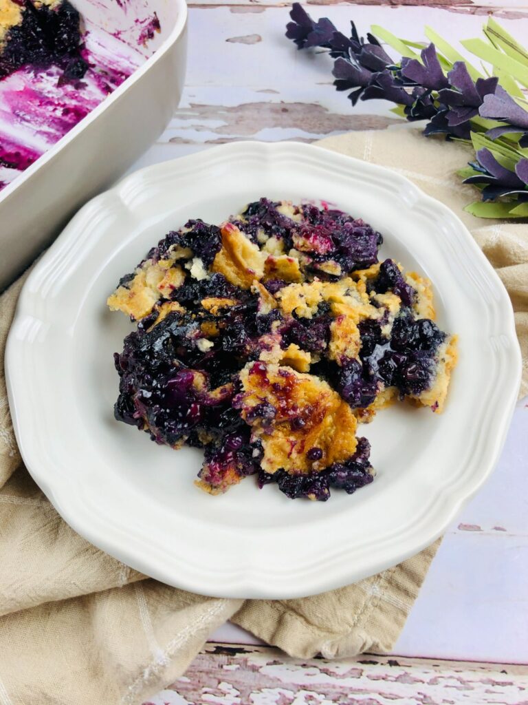 cake mix blueberry cobbler on a white plate