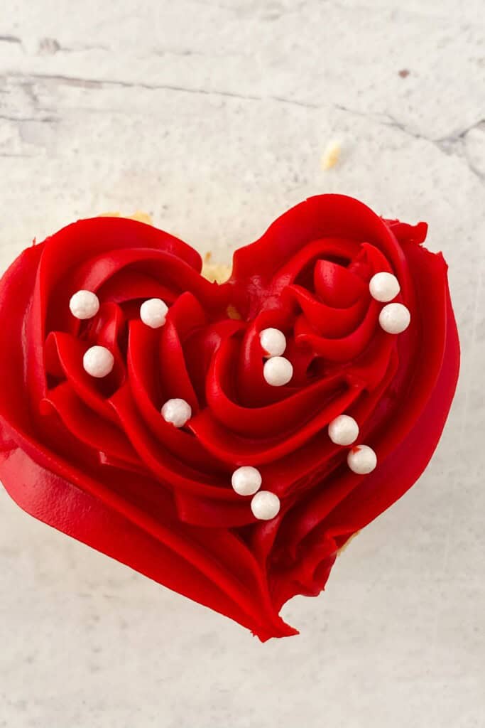 A top shot of the heart shaped cupcakes.