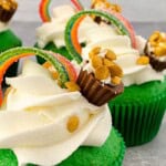 A close up on the rainbow st patricks day cupcake.