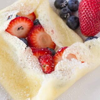 pancake crepes stuffed with strawberries and blueberries
