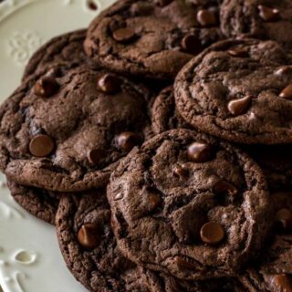 chocolate cake mix cookies on a plate stuffed with chocolate chips