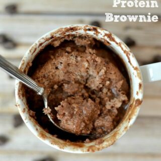protein mug brownie with a spoon and chocolate chips