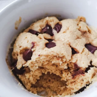 peanut butter protein mug cake topped with chocolate chips