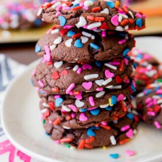 stacked chocolate cake mix cookies with colorful sprinkles
