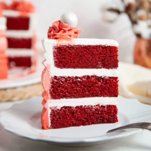 a slice red velvet cake from mix with layers of frosting