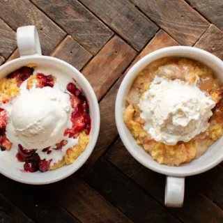 crockpot his and hers cobbler in mugs and topped with whipped cream