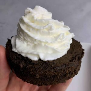 protein mug brownie topped with whipped cream
