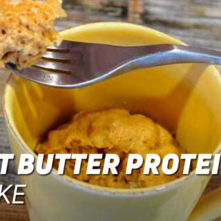 peanut butter protein mug cake served in a yellow mug with a fork