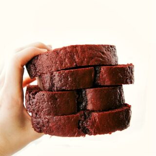 red velvet pound cake stacked in a person's hand