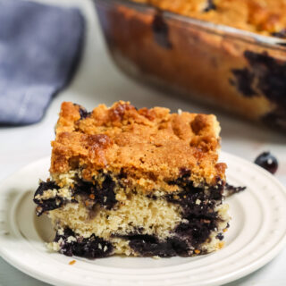 Delicious piece of Blueberry Coffee Cake on plate