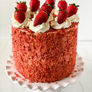 Strawberry crunch cake with fresh strawberries on top