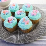 A platter of fun cotton candy cupcakes.