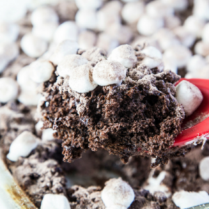 hot chocolate dump cake topped with tiny marshmallows