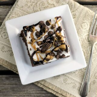 chocolate peanut butter dump cake dressed with caramel and chocolate drizzle