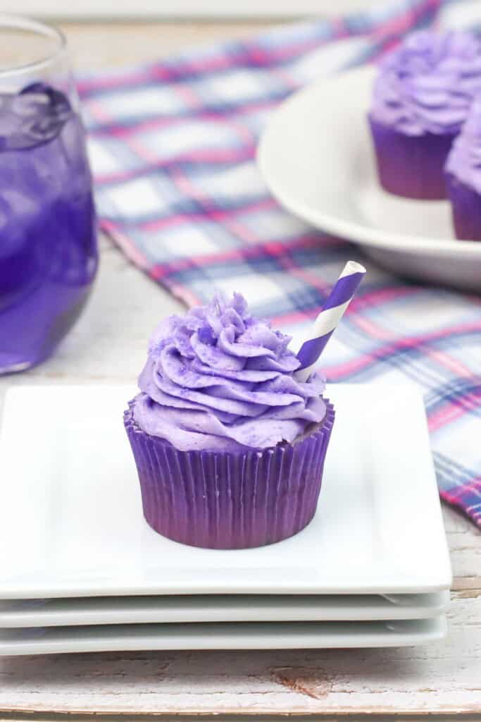 A single grape soda cupcakes on a plate.